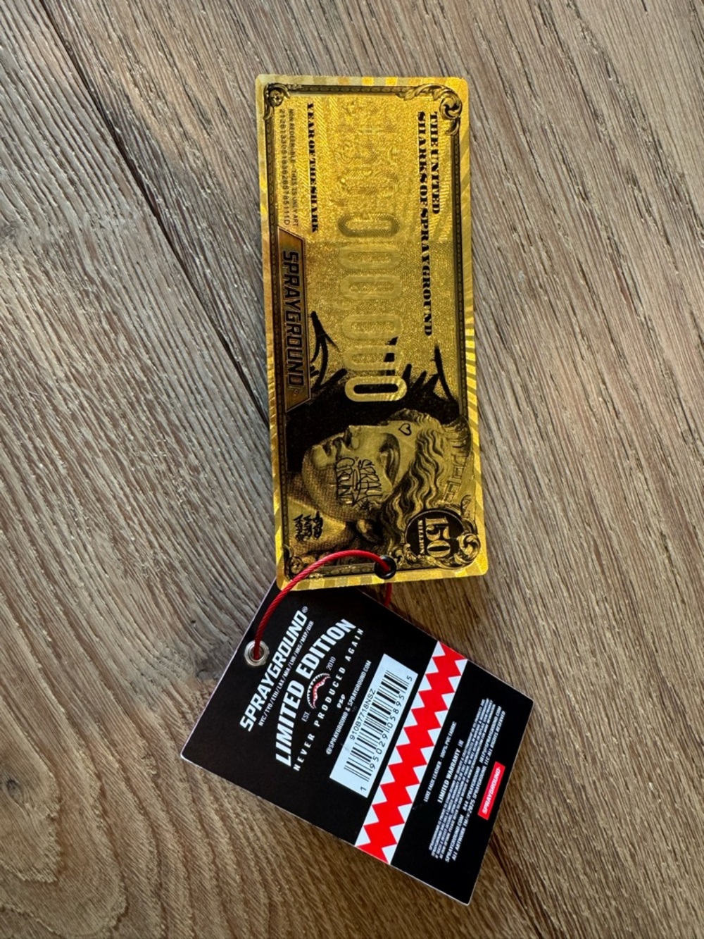 Sprayground Gold Novelty Tag with Black Limited Edition Tag